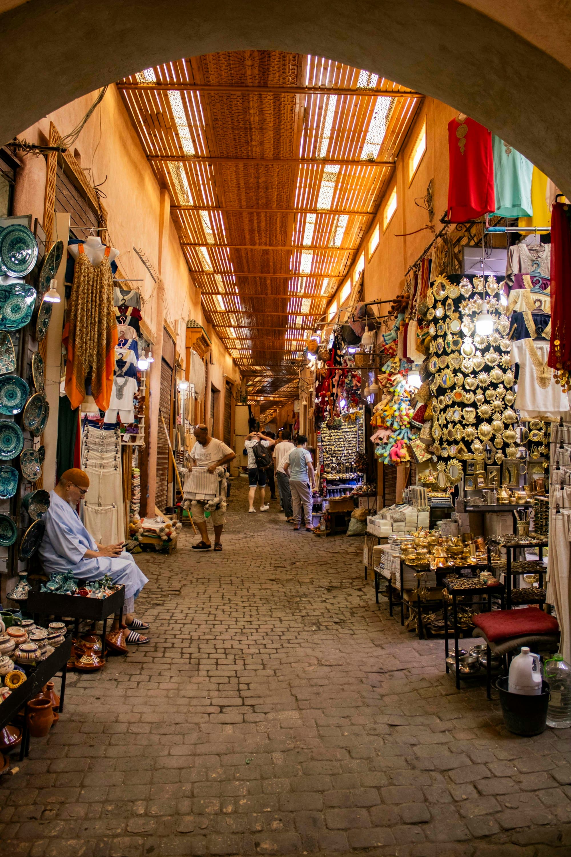 A covered alley in a spice market lined with stalls